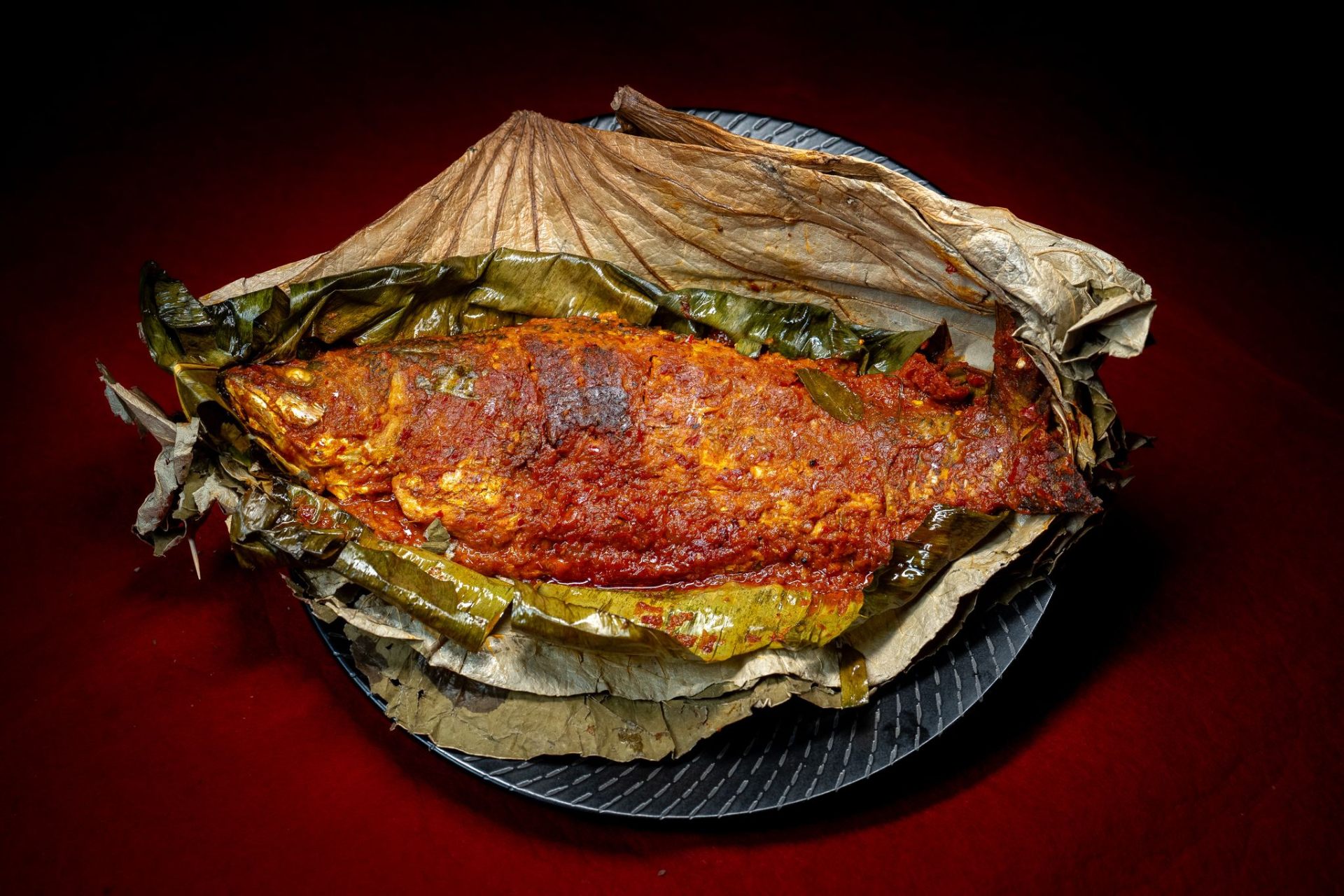 Meen Pollichathu — Seabass wrapped in lotus leaf.. Served at Café Malabar, authentic Kerala & Malabar restaurant at 142 Arab Street, Singapore.