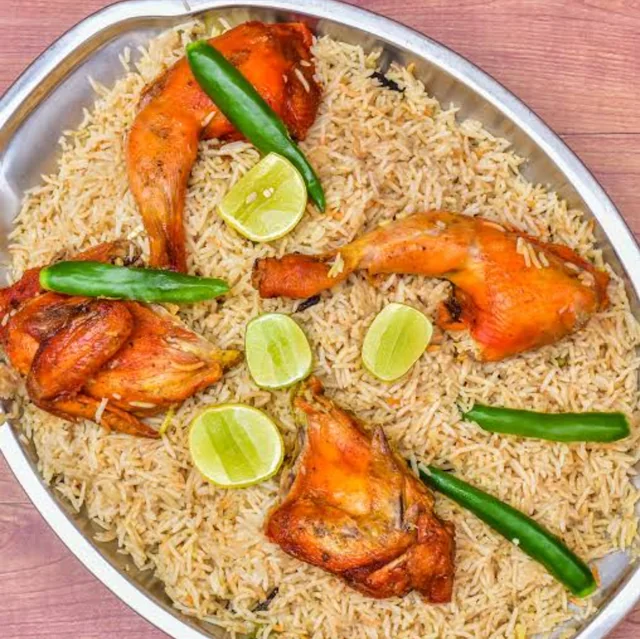Malabar Mandi — Smoked rice, gentle spice, family-style platter.. Served at Café Malabar, authentic Kerala & Malabar restaurant at 142 Arab Street, Singapore.