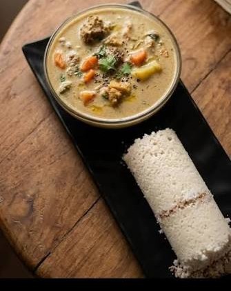 Puttu & Beef Stew — Steamed rice cake with slow-cooked beef stew.. Served at Café Malabar, authentic Kerala & Malabar restaurant at 142 Arab Street, Singapore.